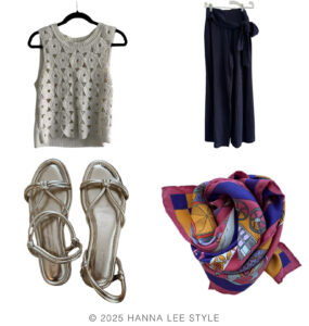 travel capsule wardrobe outfit example with wide leg navy pant, Hermes silk scarf with colors of purple and pinks and gold metallic sandal