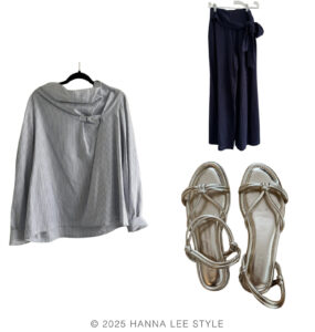 travel capsule wardrobe outfit example with a long sleeve blue and white stripe top, a pair of navy wide leg pants, a pair of gold metallic sandals